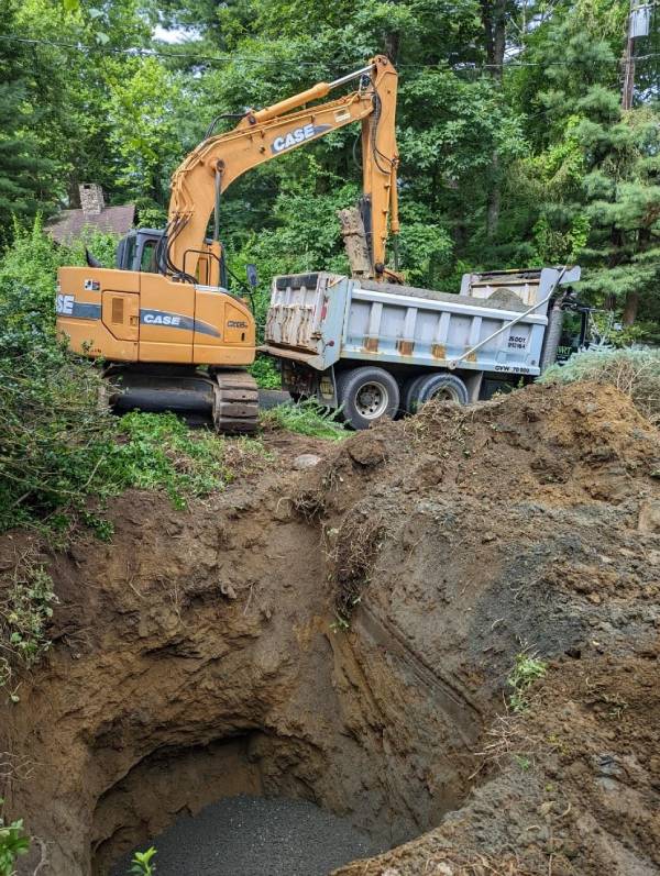Excavator working on a deep excavation site